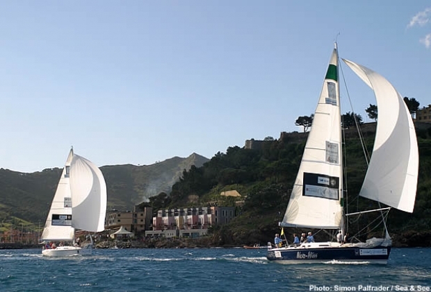 Karol Jablonski and the Toscana Challenge lead Russell Coutts and Alinghi Team down the second run and toward the finish of their Flight 11 match
