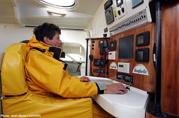 Jean le Cam at the chart table on Bonduelle